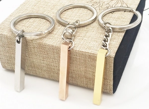 Polished stainless steel rectangular pendant keychains in silver, gold, and rose gold