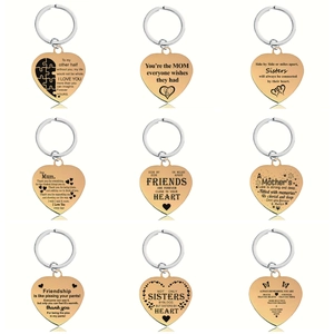 Collection of nine polished gold heart keychains with engraved English sentimental quotes