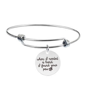 Detailed engraving on silver stainless steel bracelet with dog paw print charm