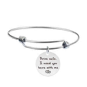 Polished stainless steel adjustable bangle with engraved Drive Safe message and heart