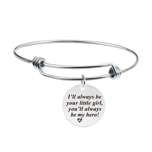 Close-up of silver stainless steel bangle with engraved heart quote for father and daughter