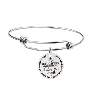 Polished stainless steel charm bracelet with engraved round pendant and crown elements