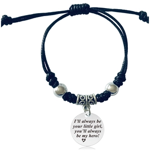 Detail of woven bracelet with engraved charm I will always be your little girl message