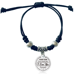 Detail of woven rope bracelet with engraved To My Son metal charm and silver beads