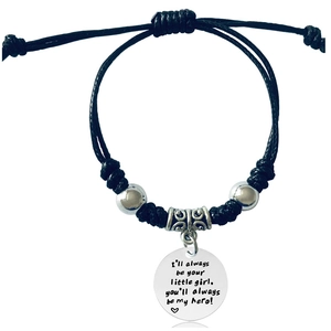 Detail of black woven rope bracelet with engraved hero pendant and adjustable cord