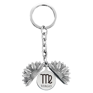 Silver metal sunflower locket keychain with Virgo zodiac sign engraving inside