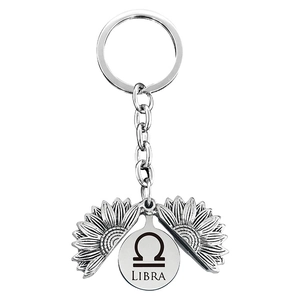 Detail of Libra zodiac sunflower keychain with engraved antique silver metal petal mechanism