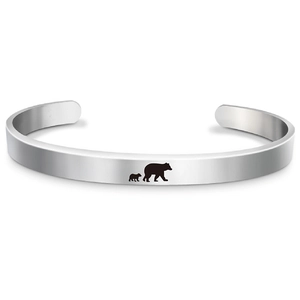 Detailed close-up of Mama Bear engraved silhouette on polished stainless steel cuff bracelet