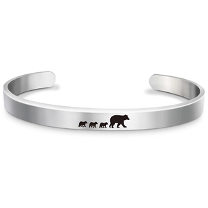 Silver stainless steel mama bear cuff bracelet featuring an engraved bear family silhouette