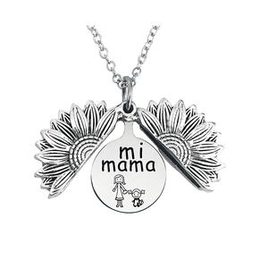 Detailed macro view of silver sunflower locket necklace with mi mama engraving inside