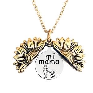 Detail of opening sunflower locket necklace with mi mama engraving in stainless steel