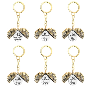 Set of six gold sunflower locket keychains with personalized family engravings for Mother's Day