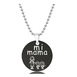 Macro detail of silver ball chain and black round pendant with mi mama engraving