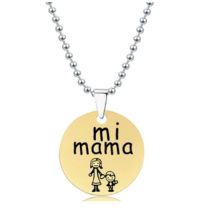 Detailed macro of golden pendant with mi mama engraving and cartoon on bead chain