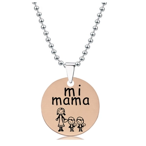 Macro detail of rose gold pendant engraved with mi mama and family illustration