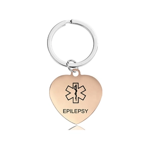 Detail of rose gold heart medical alert keychain with engraved Star of Life and Epilepsy text