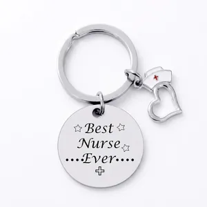Close-up of Best Nurse Ever engraved metal keychain with nurse hat and heart charms