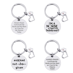 Polished stainless steel nurse keychain set with heart and cross hat charms