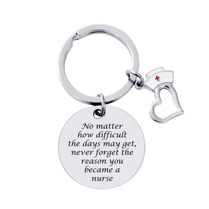 Nurse appreciation keychain with engraved silver disk, heart charm, and red cross nurse hat