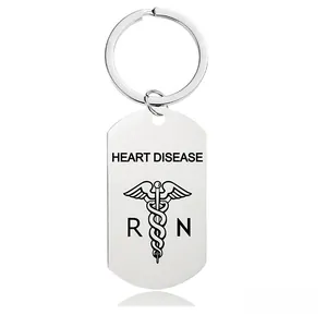 Macro detail of stainless steel medical alert keychain featuring heart disease engraving