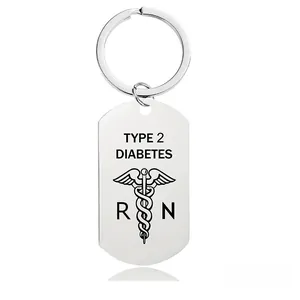 Macro detail of stainless steel keychain with Type 2 Diabetes text and medical symbol