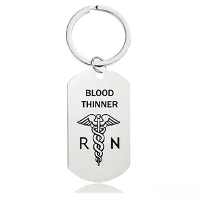 Macro detail of stainless steel keychain with Blood Thinner medical alert engraving