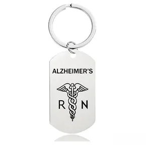 Detail of silver stainless steel keychain featuring Alzheimer's text and medical caduceus
