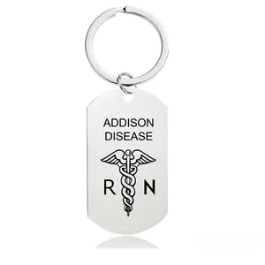 Macro detail of Addison Disease medical alert keychain with Caduceus logo and RN initials