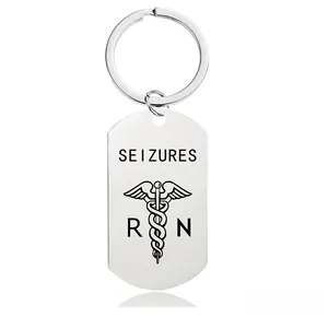 Macro detail of stainless steel keychain with SEIZURES engraving and RN medical symbol