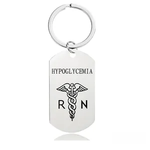 Macro view of stainless steel medical ID keychain with hypoglycemia and caduceus engraving