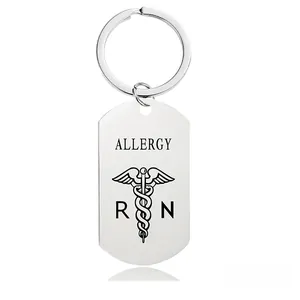 Macro view of stainless steel medical ID keychain with Allergy text and caduceus symbol