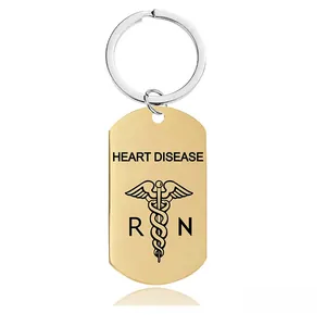 Polished gold medical keychain with engraved Heart Disease text and RN caduceus symbol