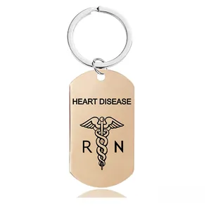 Close-up of rose gold medical alert keychain with Heart Disease engraving and caduceus