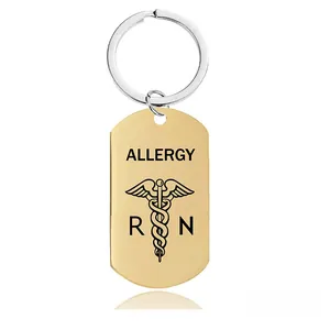Detailed macro view of gold-plated stainless steel allergy medical alert keychain