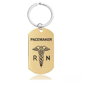 Detail showing gold pacemaker medical alert keychain with caduceus and RN symbols