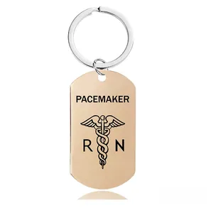 Macro detail of rose gold medical keychain with Pacemaker and RN engraved symbols