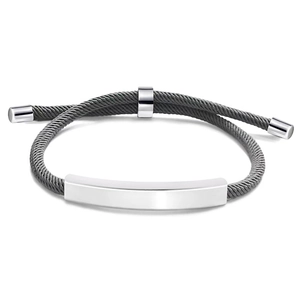 Detail of adjustable gray woven rope bracelet with a polished silver stainless steel bar