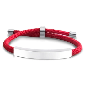 Detail of red braided nylon bracelet with adjustable silver metal plate for custom engraving