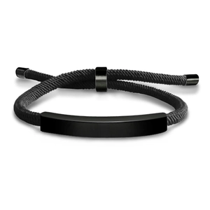 Detail of black woven rope bracelet featuring a matte black adjustable metal bar insert
