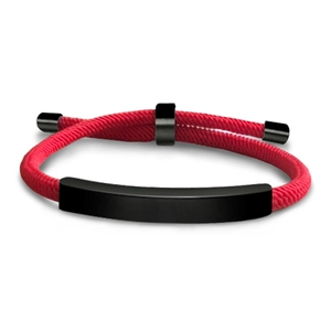 Close-up of minimalist red braided rope bracelet with a matte black curved metal plate detail