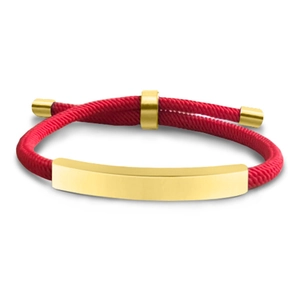 Detail of red braided rope bracelet featuring a polished gold curved metal plate