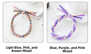Dettaglio di elastici per capelli intrecciati in colori pastello su vassoio bianco