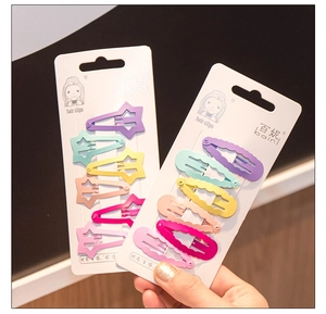 Close-up of candy color star and wave hair clips set for girls on display card