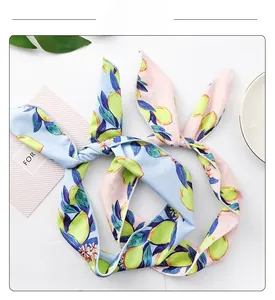 Close-up of lemon print headbands showing fine stitching and soft summer fabric texture