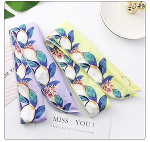Detail shot of lemon print fabric hair ties featuring precise overlock edge stitching