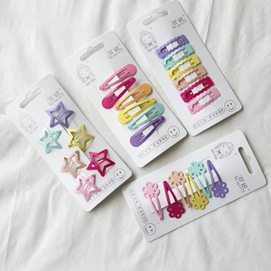 Cute candy-colored hair clip set in star and heart shapes on white background