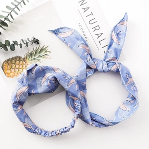 Tropical blue headband with yellow banana leaf print and stylish rabbit ear bow decoration
