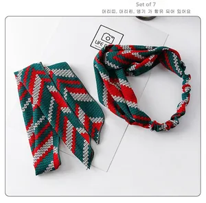 Detail of red and green knitted Christmas headband and ribbon set for children
