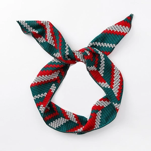 Sweet cross-knot headband with vibrant red and green zigzag patterns on white background