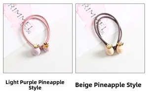 Détail d'élastiques à cheveux avec breloques d'ananas mignonnes en tons violet et beige